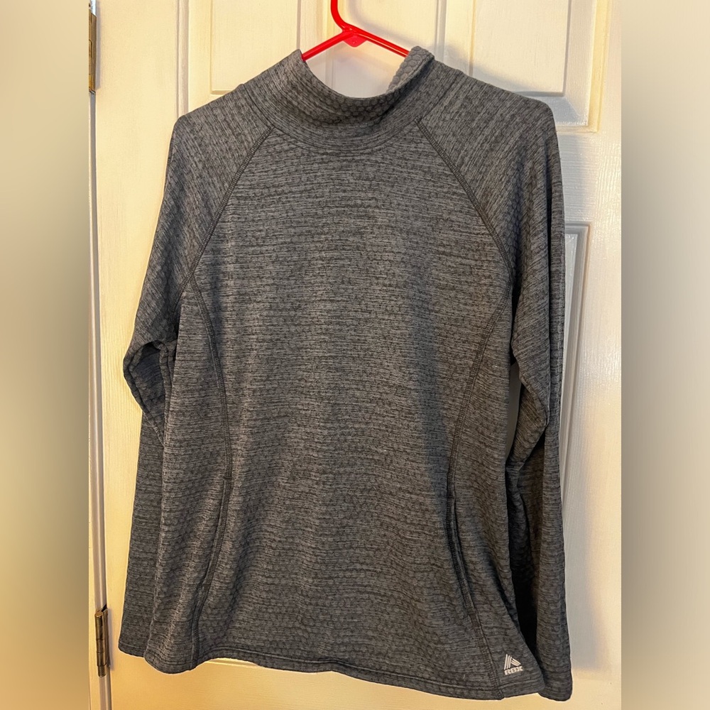 Women’s Reebok performance too with front pouch and reflective stripe on back